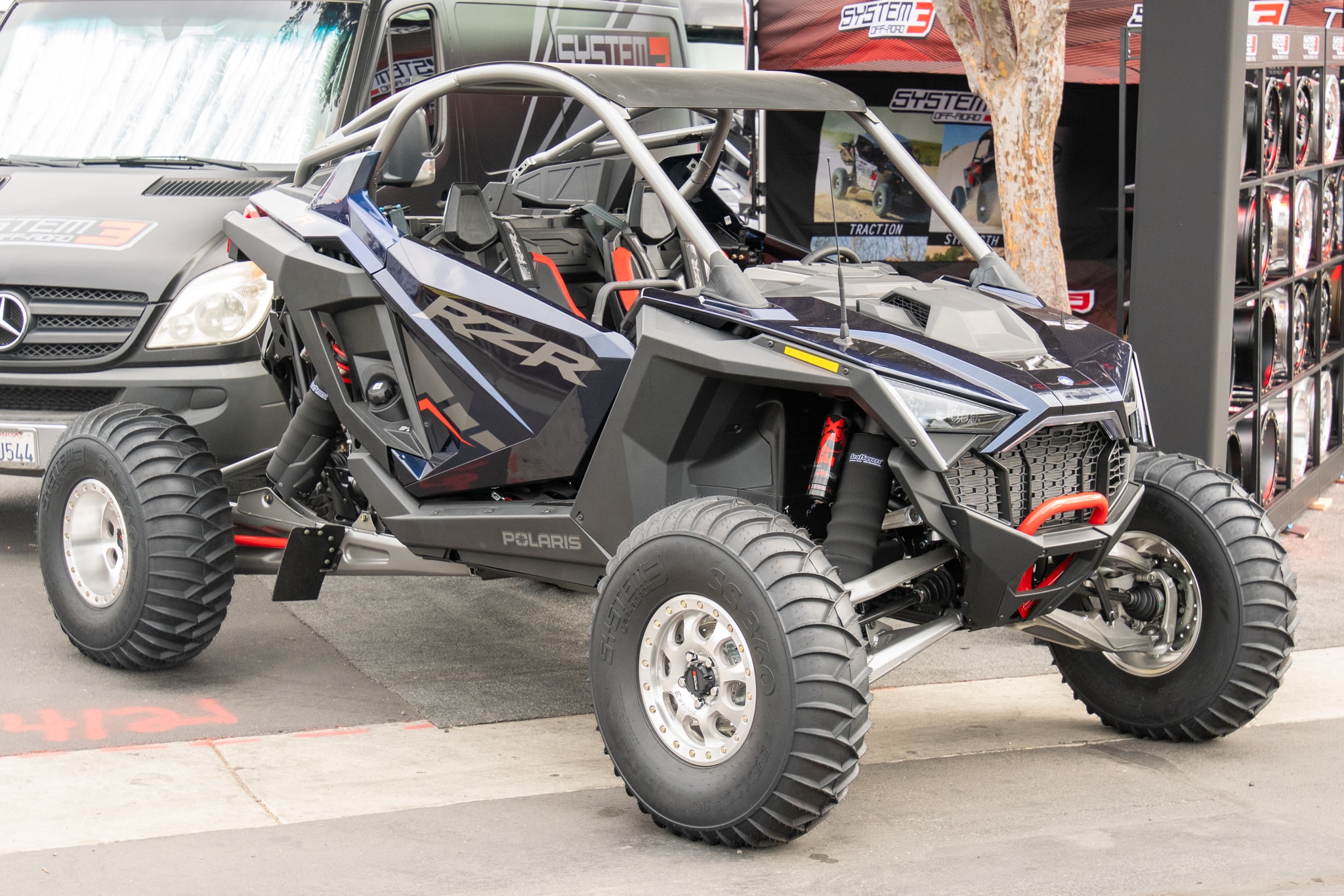 Polaris RZR Side by Side parked in front of an event booth